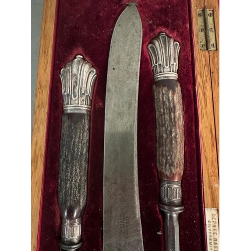 406 - A horn handled carving set with silver heels and collars, hallmarked for Sheffield 1907 by Depree Ra... 