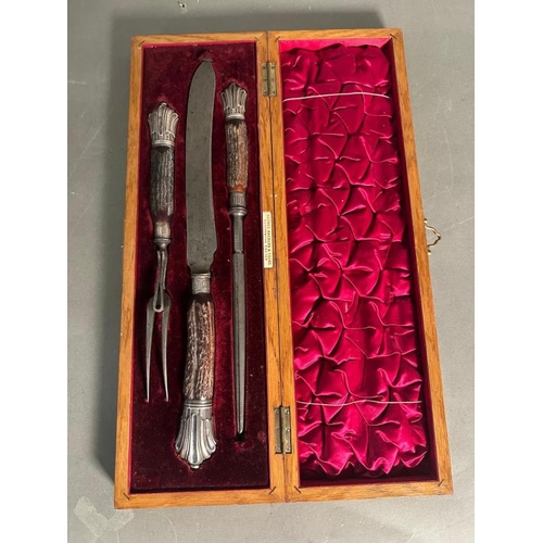 406 - A horn handled carving set with silver heels and collars, hallmarked for Sheffield 1907 by Depree Ra... 