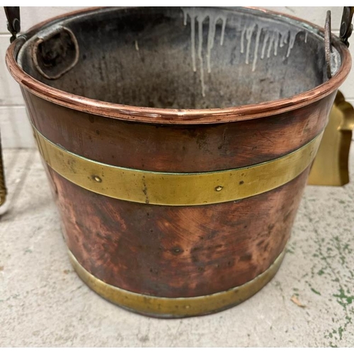 414 - A copper and brass banded coal bucket and a brass fireside companion set