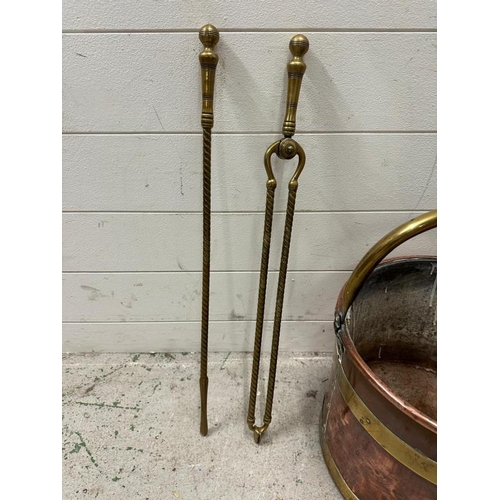 414 - A copper and brass banded coal bucket and a brass fireside companion set