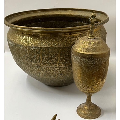 419 - A Middle Eastern brass bowl along with a brass goblet with lid