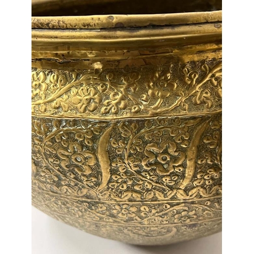 419 - A Middle Eastern brass bowl along with a brass goblet with lid