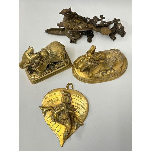 420 - A pair of brass cattle idols, Indian cast hanging oil lamp and plaque