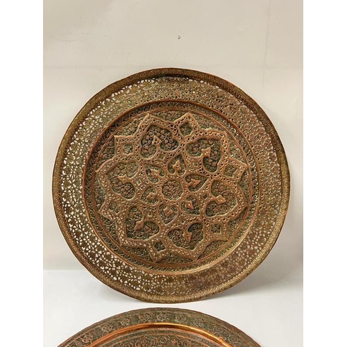 422 - Two Kashmiri copper trays (largest Dia45cm)