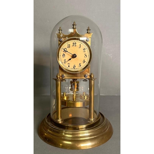 424 - A German Gustav Becker brass 400 day anniversary clock in a glass dome