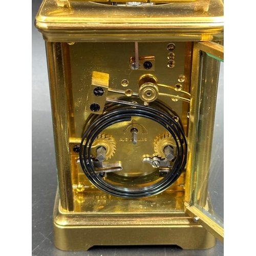 425 - An antique French Margaine carriage clock in leather travel case (Glass to top and handle need fixin... 