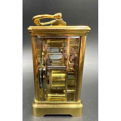 425 - An antique French Margaine carriage clock in leather travel case (Glass to top and handle need fixin... 