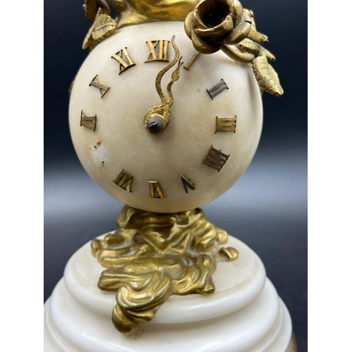 426 - A French white marble sphere clock on marble base with a bronze figure signed Kingsburger (AF)