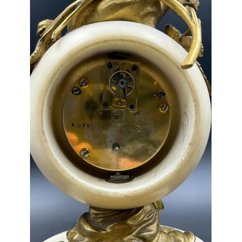 426 - A French white marble sphere clock on marble base with a bronze figure signed Kingsburger (AF)