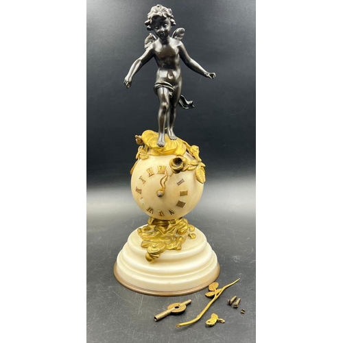 426 - A French white marble sphere clock on marble base with a bronze figure signed Kingsburger (AF)