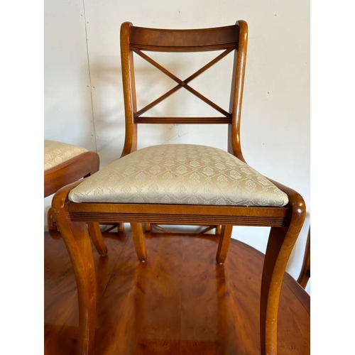 44 - A Bradley veneered extendable pedestal dining table on brass lions paw feet and seven chairs (H76cm ... 