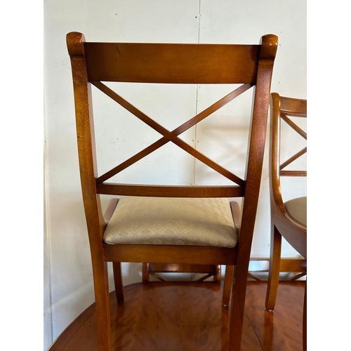 44 - A Bradley veneered extendable pedestal dining table on brass lions paw feet and seven chairs (H76cm ... 