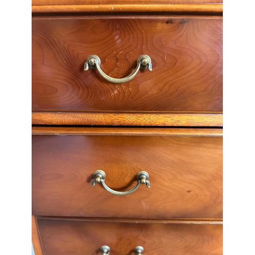 45 - A mahogany veneered tall boy with two short drawers over five long (H133cm W76cm D49cm)