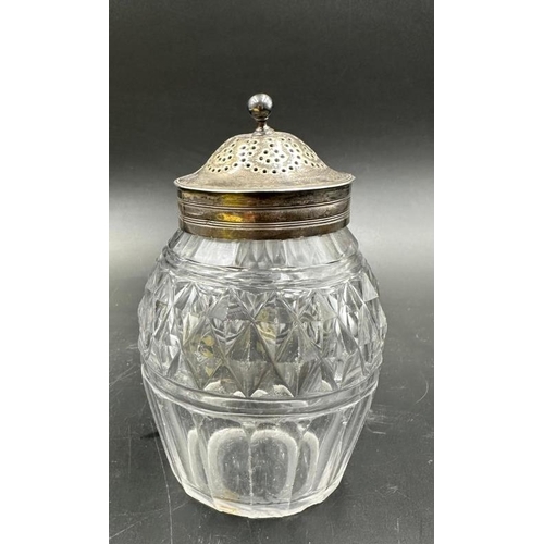 454 - A cut glass silver topped and necked sugar sifter, hallmarked.