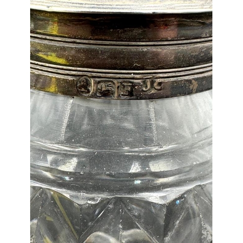 454 - A cut glass silver topped and necked sugar sifter, hallmarked.