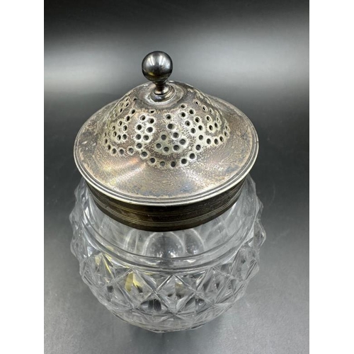 454 - A cut glass silver topped and necked sugar sifter, hallmarked.