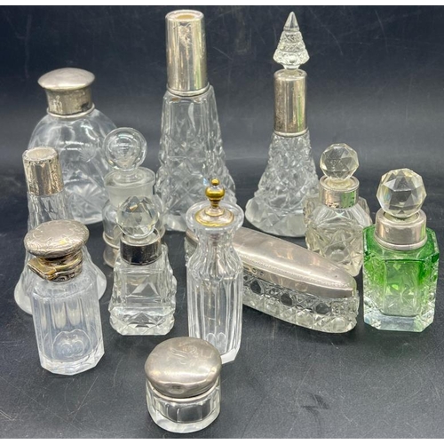 456 - A selection of twelve dressing table / scent bottles with hallmarked silver fittings.