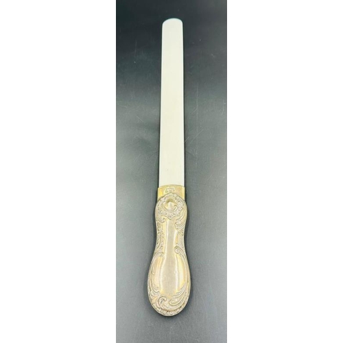 460 - A silver handled bone letter opener, hallmarked for Birmingham