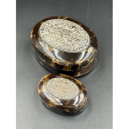 467 - Two tortoiseshell style and silver topped pill boxes