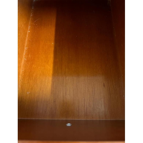 47 - A mahogany veneer sideboard with a bevel edged mirror over and multiple long and short drawer under ... 