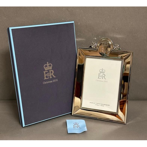 476 - A silver plated easel backed photograph frame, a Christmas present 2016 from Queen Elizabeth II give... 