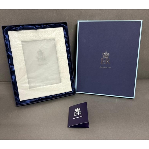 477 - A silver plated photograph frame (wrapped), a Christmas present 2021 from Queen Elizabeth II given a... 