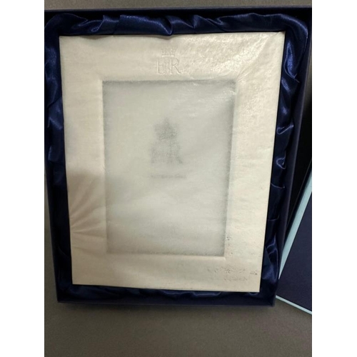 477 - A silver plated photograph frame (wrapped), a Christmas present 2021 from Queen Elizabeth II given a... 