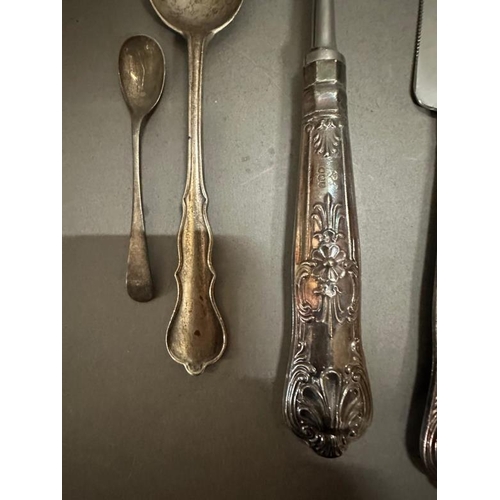 479 - A selection of silver and silver handled items to include sugar tongs, serving spoon, spoon etc.