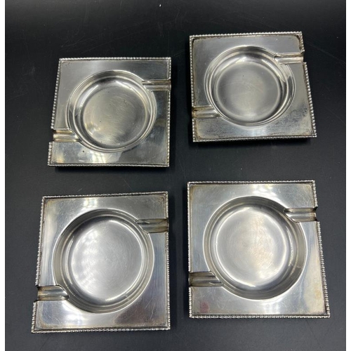 483 - A set of four ashtrays, marked silver with an approximate weight of 347g