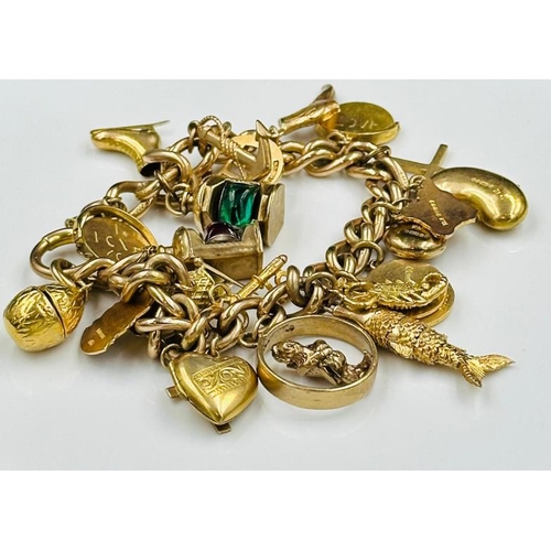 494 - A 9ct gold charm bracelet with a variety of charms and an approximate weight of 55g