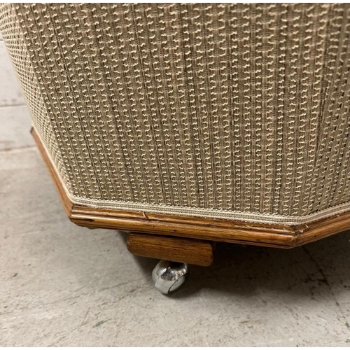 5 - An oak framed Art Deco lounge chair in a beige upholstery