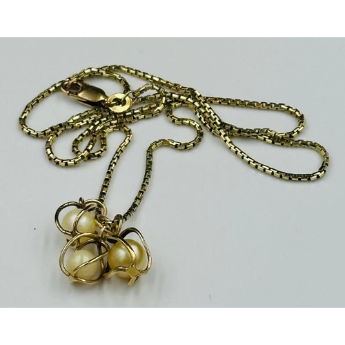 506 - A 14ct gold necklace with three pearl pendants, approximate weight 6.5g