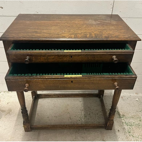 52 - An oak cutlery table with drawers opening to felt lining (H77cm W68cm D40cm)