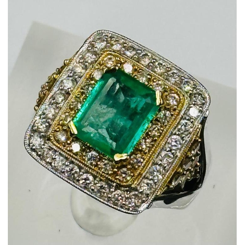 529 - An emerald and diamond three tier square cluster ring with diamond set shoulders.Central emerald cut... 