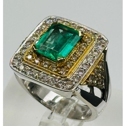 529 - An emerald and diamond three tier square cluster ring with diamond set shoulders.Central emerald cut... 