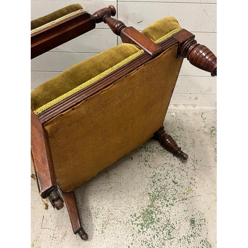 54 - A Victorian upholstered elbow chair