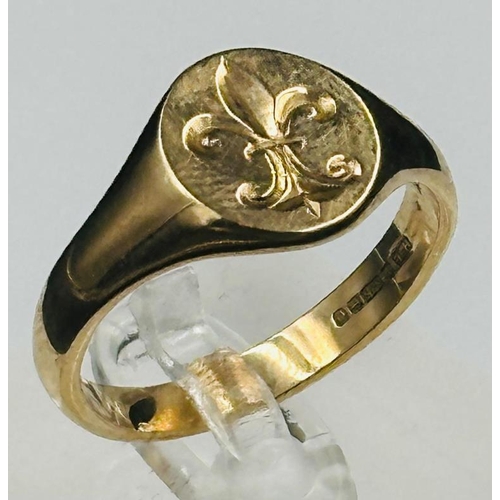 543 - A 9ct gold signet ring with a Fleur De Lis, approximate weight 5.9g