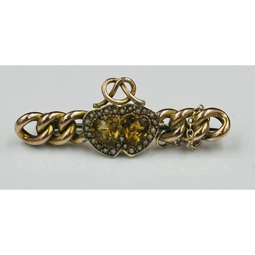 544 - A 9ct gold sweetheart brooch with intertwined hearts with yellow stones, approximate eight 4.8g