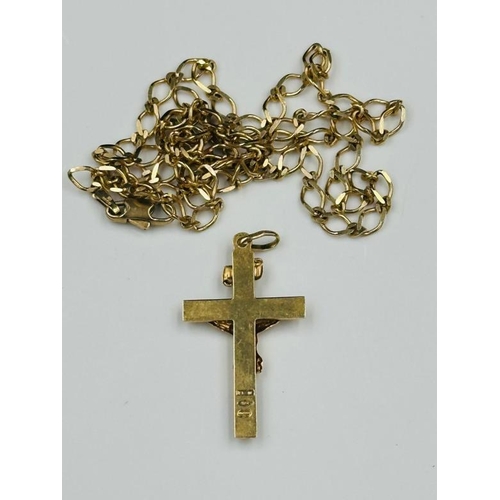 549 - A 9ct gold cross and chain, with and approximate weight of 8g