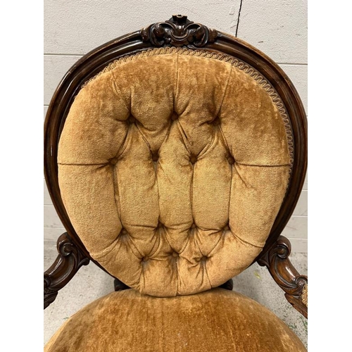 58 - A Victorian walnut button back ladies chair n a brown velvet upholstery