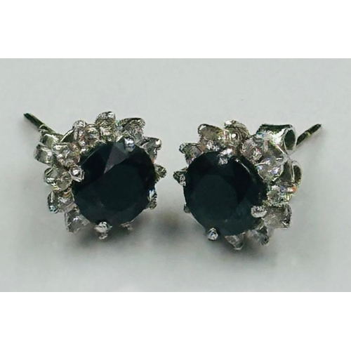 594 - A pair of sapphire and diamond stud earrings