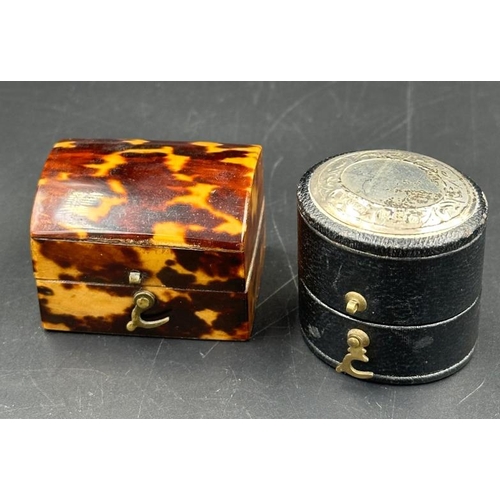 610 - A tortoiseshell ring box along with a leather silver topped ring box