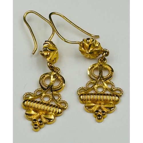 614 - A pair of highly decorative Persian gold earrings with an approximate weight of 4.6g