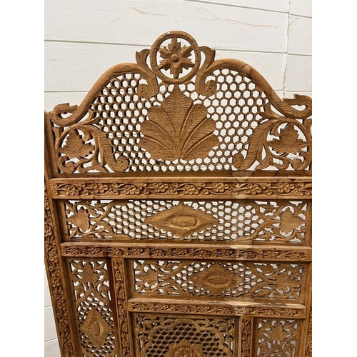 65 - Four panel folding teak screen with honey coombe pattern and carved leaves 50cm x 180cm