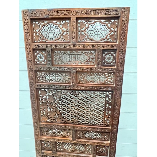 66 - A wall hanging teak screen 46cm x 180cm