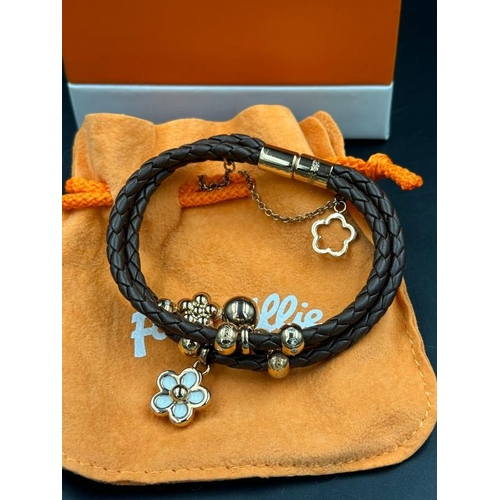 682 - A Folli Follie three strand leather bangle with charms