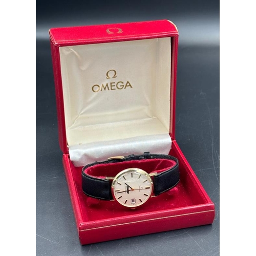 726 - A Vintage 1970's Gold Omega in original box with paperwork, engraved to back and on black leather st... 