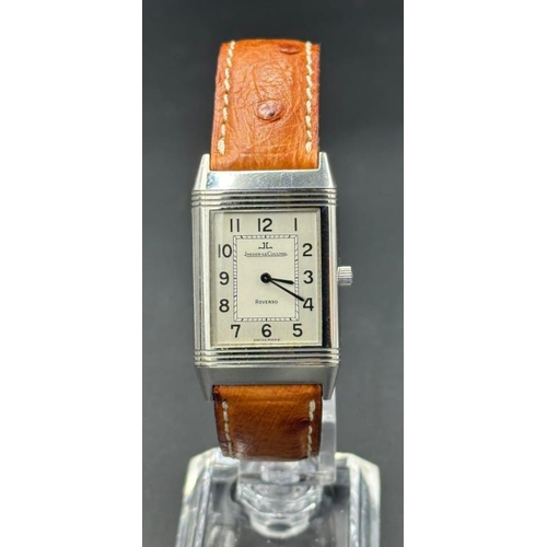 732 - A Jaeger Le Coultre Reverso on an ostrich strap No 250886, with original papers.