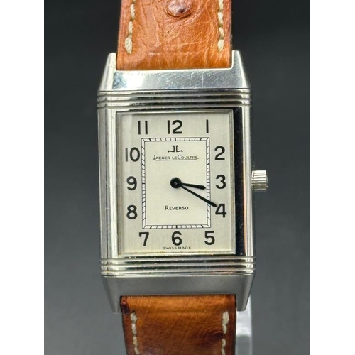 732 - A Jaeger Le Coultre Reverso on an ostrich strap No 250886, with original papers.