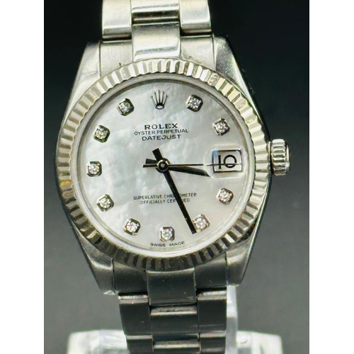 736 - A Mid Size Rolex Oyster Perpetual date-Just watch. Model No 178274 Serial No 1542V493